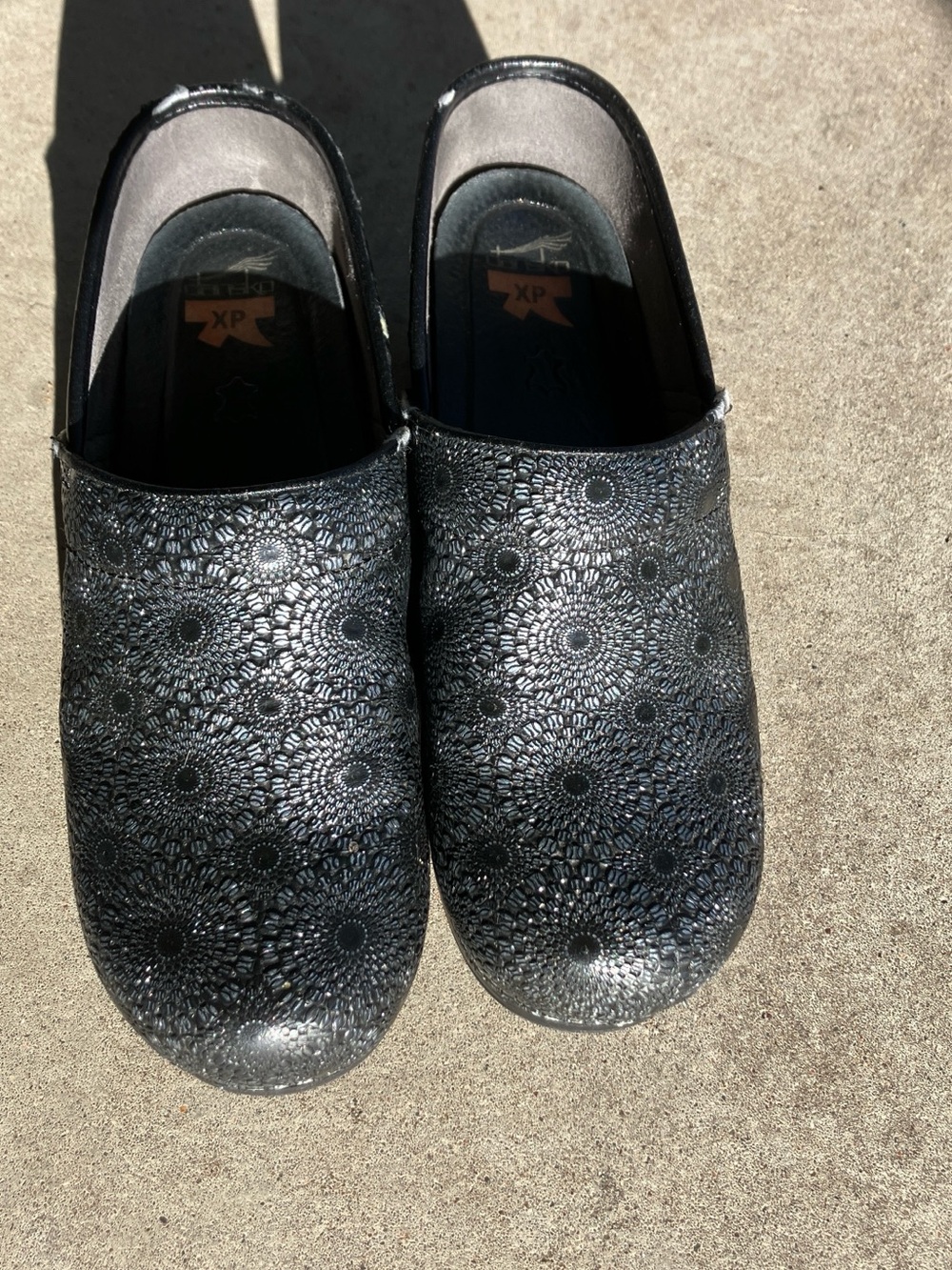 Dansko Black Floral Embossed Clogs